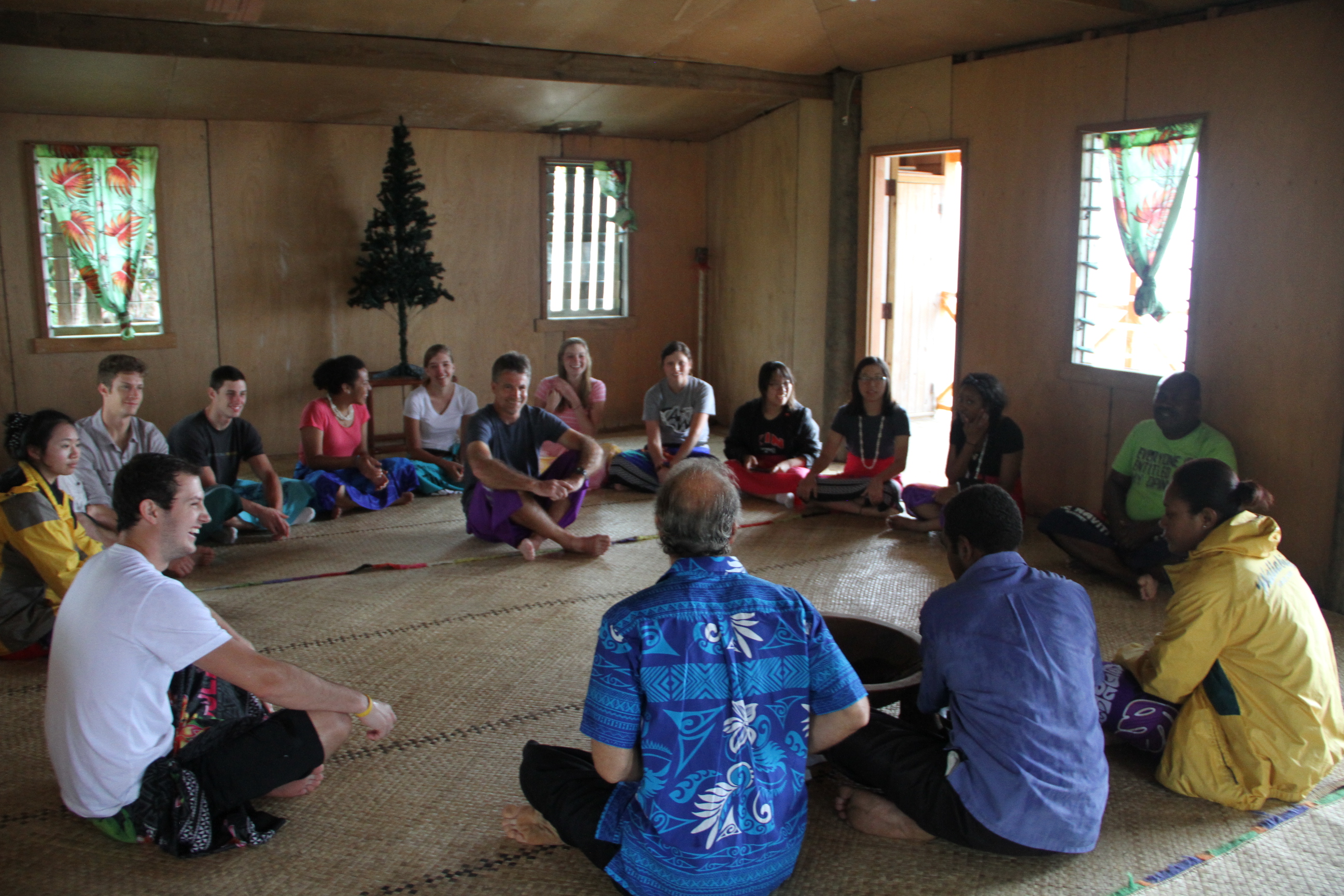 Students listening to locals' introduction of the kava ceremony