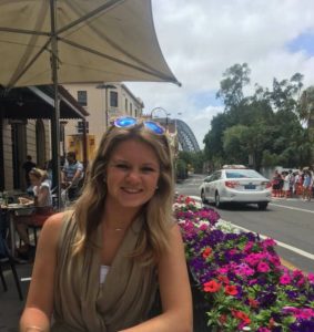 Photo of Emily Fessler at roadside cafe in Sydney