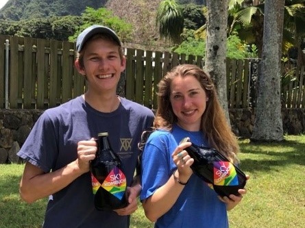 Lucas and his sister with "growler" jugs in Oahu