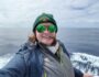 Previous Student, Kennedy Fast, on the Viewing Deck of the M/V Ushuaia ship with the ocean behind